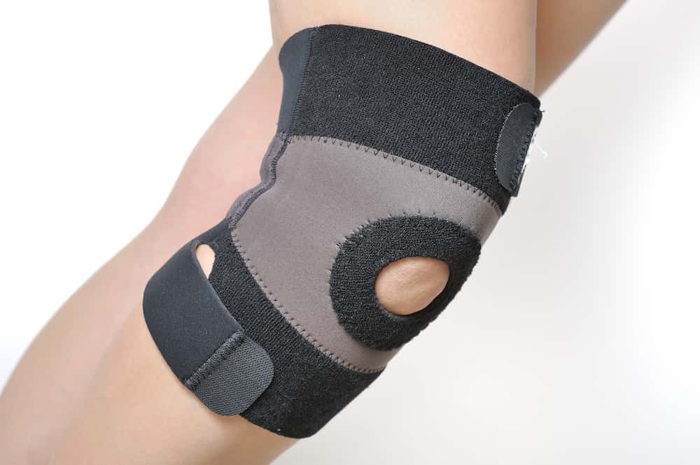 a medical knee brace on a human leg.