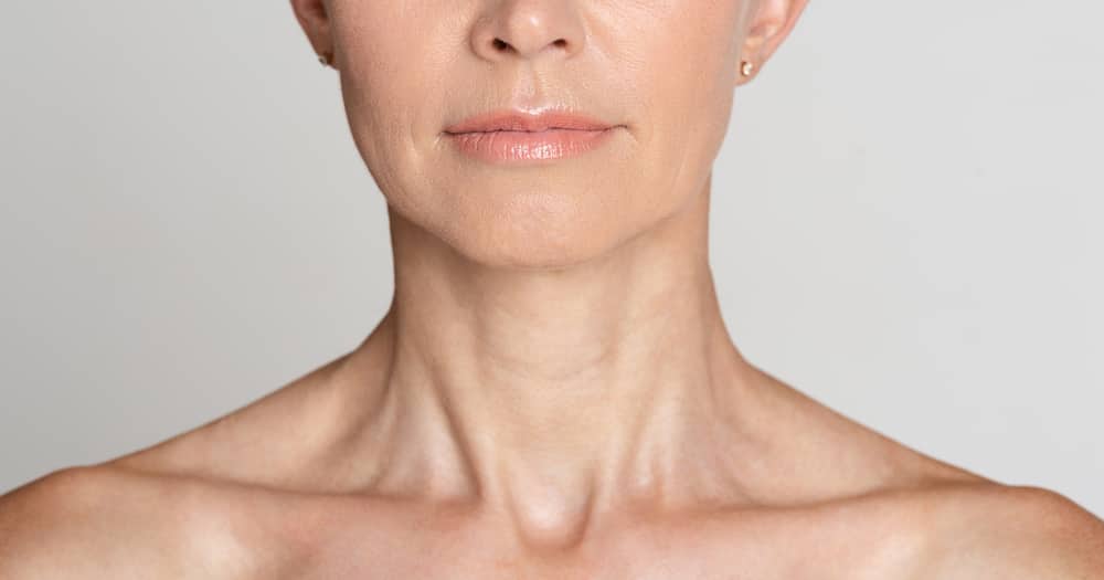 A close-up of a woman's lower face and neck.